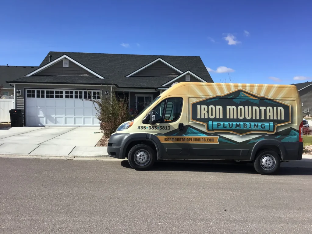 Iron Mountain truck outside a house that needs hard water treatment Cedar City